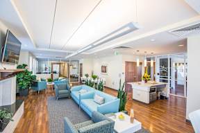 A modern community space with blue and grey furniture.