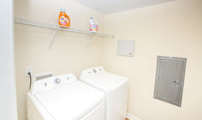 A laundry room with a washer and dryer.