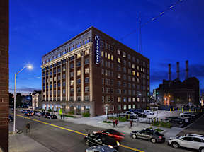A large building with the word "Pendleton" on it is lit up at night.
