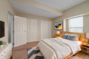 a bedroom with a bed and a tv