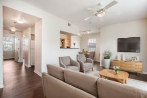 a living room with couches and a tv