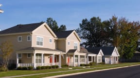 a row of houses on the side of a street
