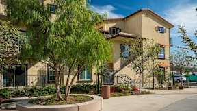 Apartment building exterior with walkways and landscaping-Parque Vista, Los Angeles, CA