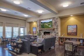 a living room with a fireplace and couches