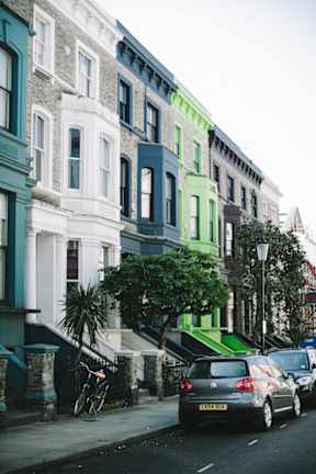 a city street with cars parked in front of buildings