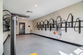 a bike rack hangs on the wall in a room with a concrete floor