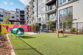 a playground in front of an apartment building