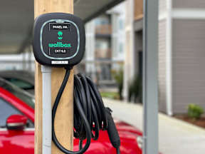a charging cord is plugged into a pole at Pottery Creek Apartments, Port Orchard
