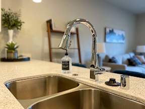 a kitchen with a sink and a faucet at Pottery Creek Apartments, Washington, 98366