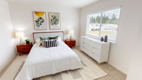 a bedroom with a bed and a window