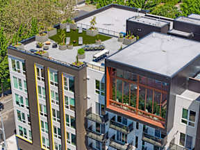 an aerial view of a large building with a green roof at Hue Apartments, Washington