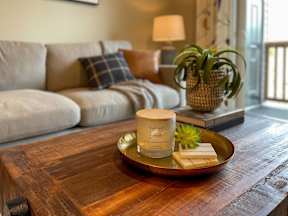 a coffee table in a living room with a couch at Pottery Creek Apartments, Port Orchard, 98366