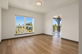 Empty room with a view of the street outside.