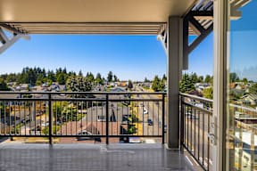 A balcony with a view of a residential area.