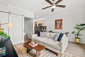 a living room with a couch and a coffee table at Hue Apartments, Washington, 98052