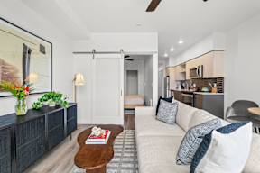 a living room with a couch and a coffee table at Hue Apartments, Redmond , 98052