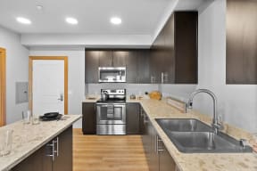 a kitchen with a counter top and a sink