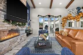 A living room with a fireplace and a couch.