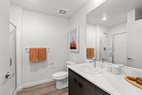 a bathroom with a sink and a toilet and a shower at Hue Apartments, Washington, 98052