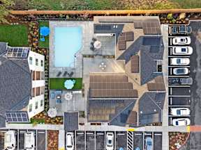 A large building with a pool in the middle of it.