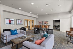 a view of the lobby of a building with stairs and couches