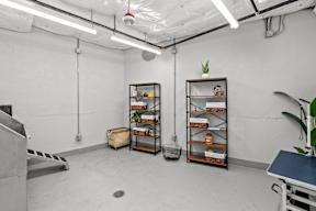 a room with white walls and shelves in the corner of a room at Hue Apartments, Redmond , 98052