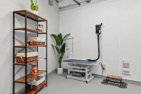 a workout room with a treadmill and a yoga table in it at Hue Apartments, Redmond , WA 98052