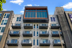 the facade of a building with many windows and balconies at Hue Apartments, Redmond