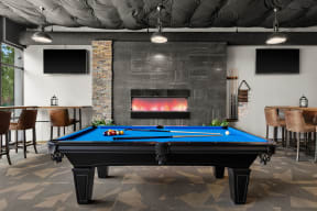 a games room with a pool table and a fireplace