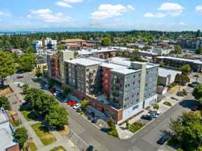 an aerial view of an apartment building in a city