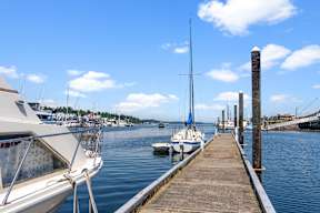 a dock with boats in the water at a marina