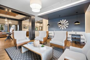 a living room with blue walls and white furniture