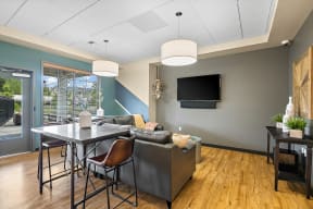 the reserve at city center spacious living room with dining table and tv