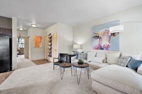 a living room with a white couch and a table