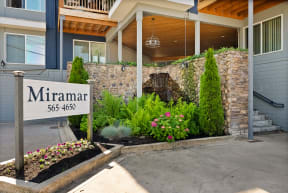 the front yard of a building with a sign that reads