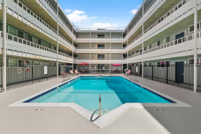a swimming pool in the middle of an apartment building