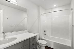 a bathroom with a bathtub and a sink