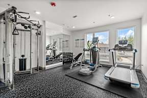 the gym at the enclave at woodbridge apartments in sugar land, tx