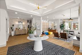 a living room with a white table and a rug at Telka Apartments, Silverdale