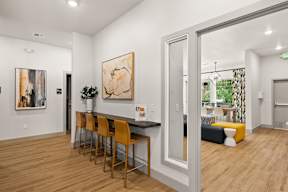 a dining room and living room with a table and chairs at Telka Apartments, Silverdale, Washington