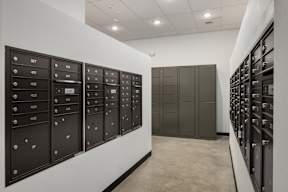 A row of mailboxes are lined up on a wall.