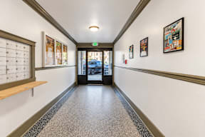 A hallway with a sign that says