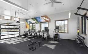 fitness studios with cardio equipment and weights