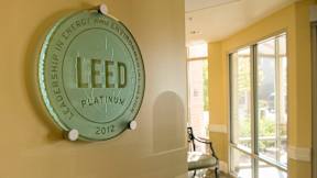 A glass plaque on a wall that says LEED Platinum 2012.