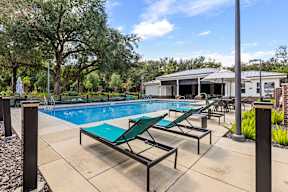 Pool and lounge area at The Flats at Tioga Town Center apartments in Newberry, FL.