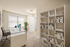 Functional room featuring a desk, chair, and bookshelf at Claremont Apartments in Exton, PA