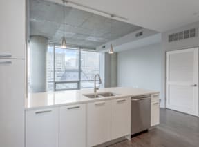 Interior Image of Apartment Kitchen looking into Living Room