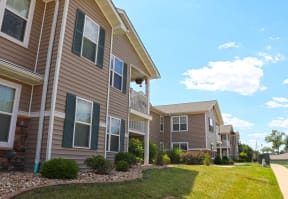 Grassy Area and Buidling Exterior with Gray siding