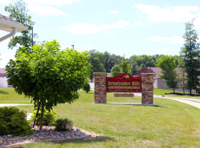Monument Sign with Stone Pillars and contact information