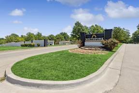Property sign at entry at Southfork MHC in Belton, MO